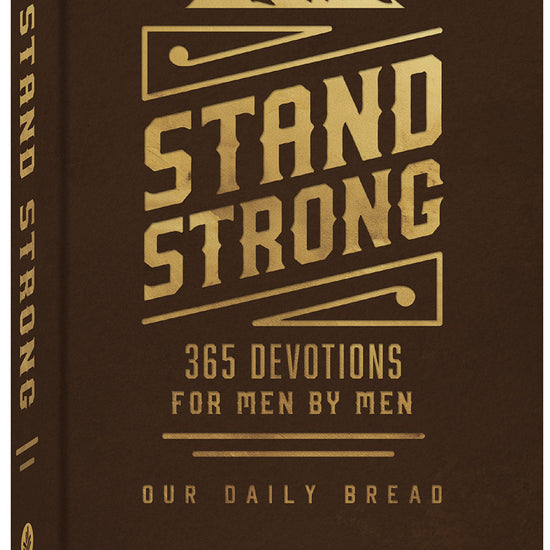 3D cover of the 'Stand Strong: 365 Devotions For Men By Men' book by Our Daily Bread, showing the decorative ribbon page marker